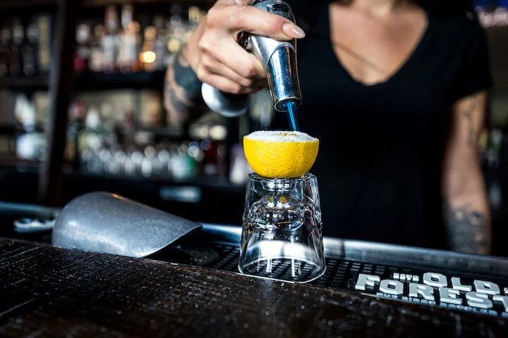 Bartender pouring a cocktail