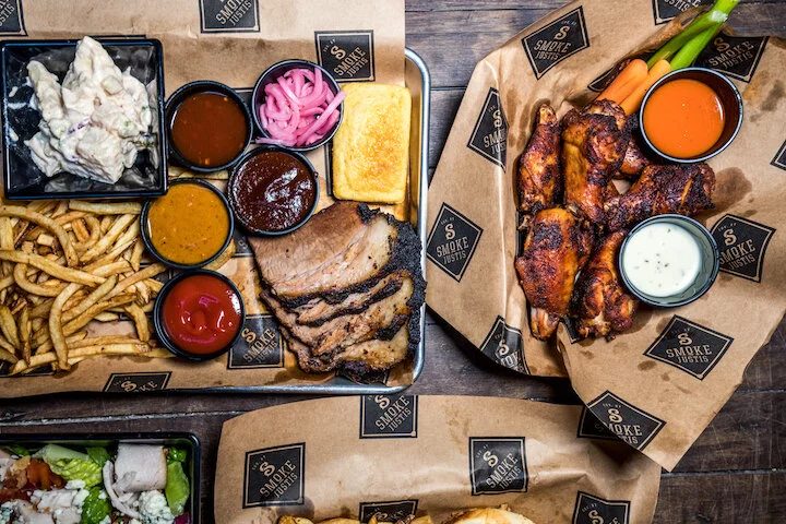Smoked brisket tray with sides and smoked wings